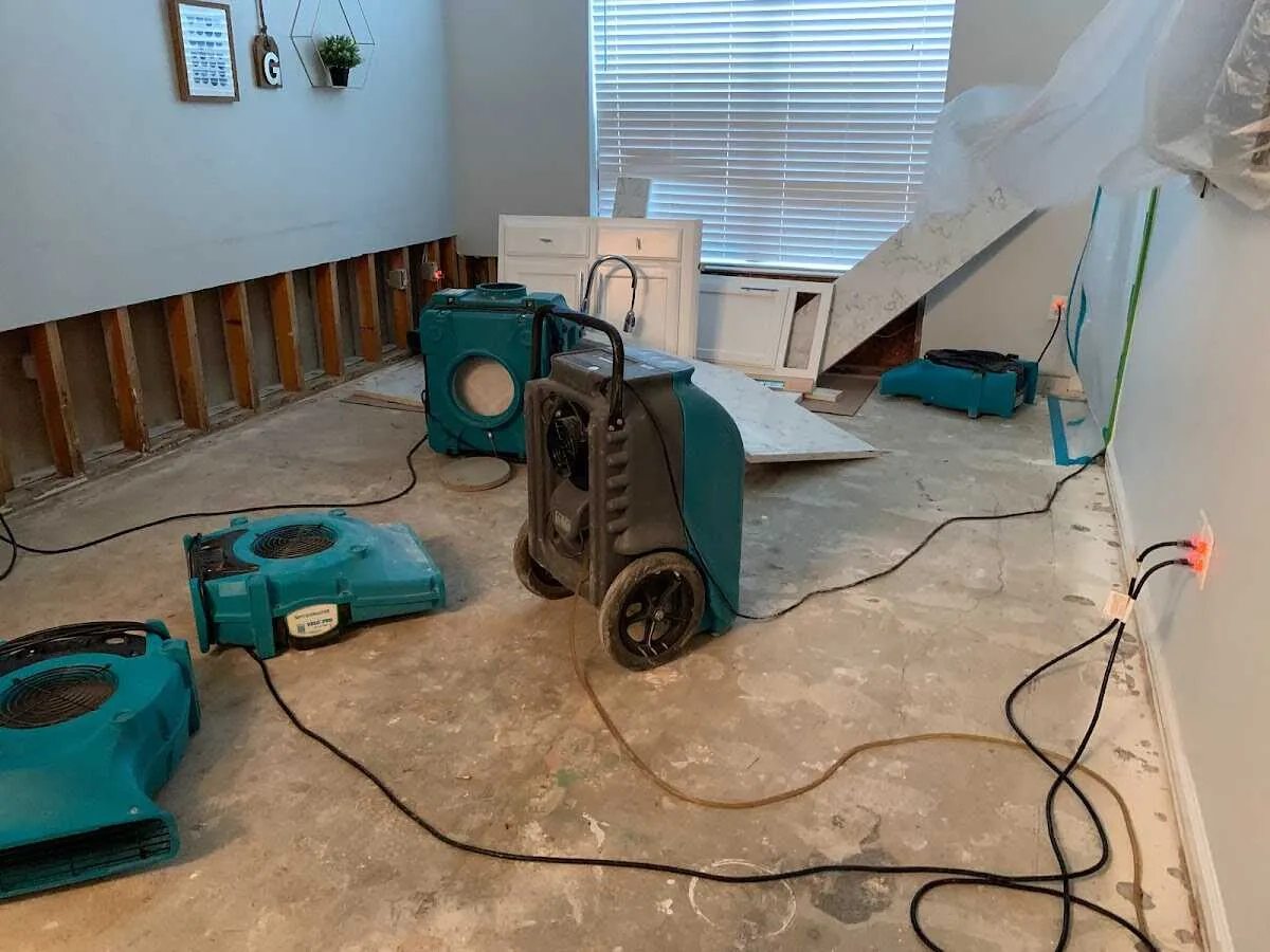 Dehumidifier in flood-cut room for Water Damage Restoration in Dacono